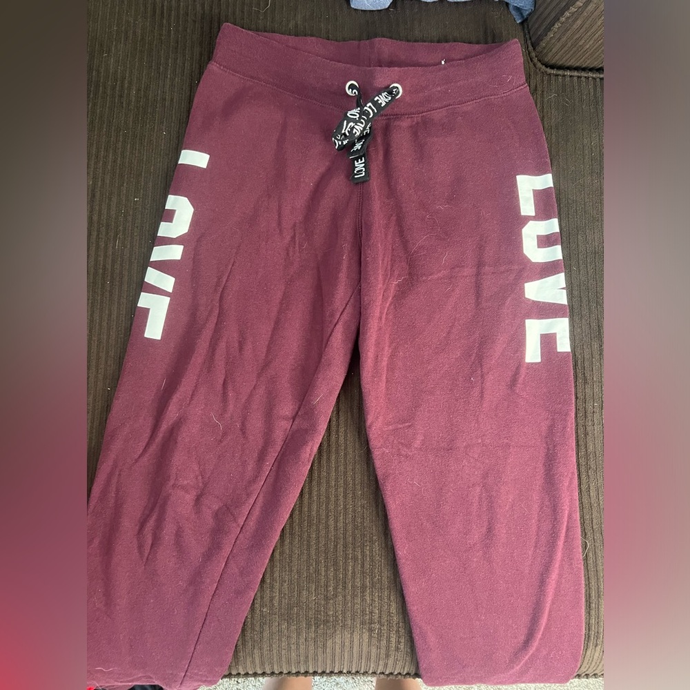Purple love sweatpants . Worn twice . Size large